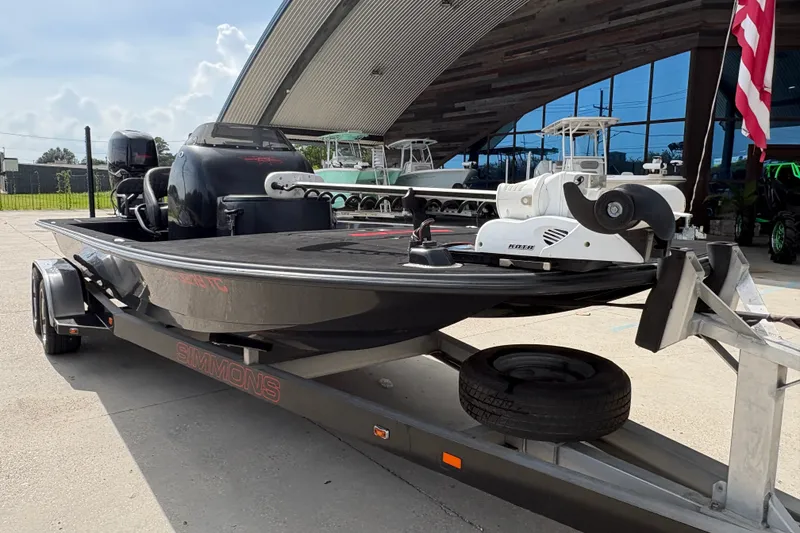 Slide: The Image of 2016 SCB 247 boat on trailer, featuring a sleek design and powerful outboard motor. - 10