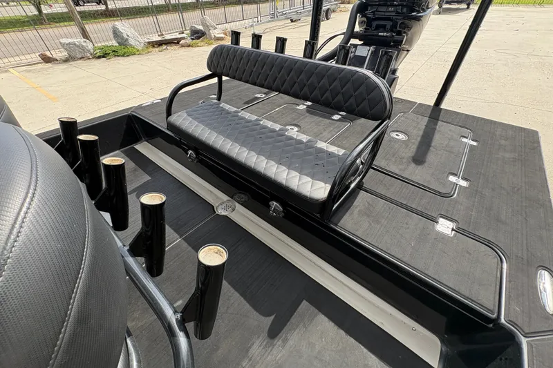 Slide: The Image of 2016 SCB 247 boat interior with black seating and rod holders. - 17