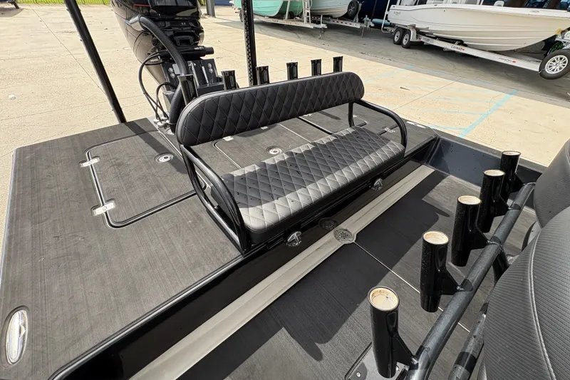 Slide: The Image of 2016 SCB 247 boat interior with black seating and multiple rod holders. - 15