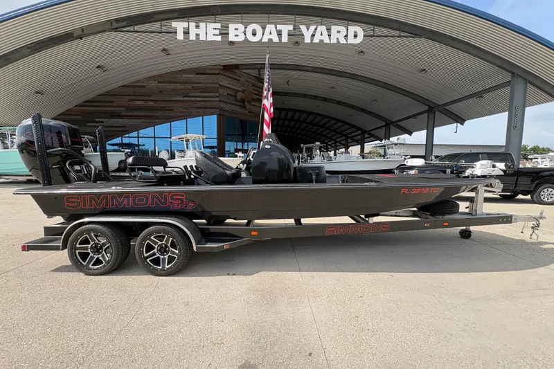Slide: The Image of 2016 SCB 247 boat on trailer at The Boat Yard, featuring sleek design and dual motors. - 3