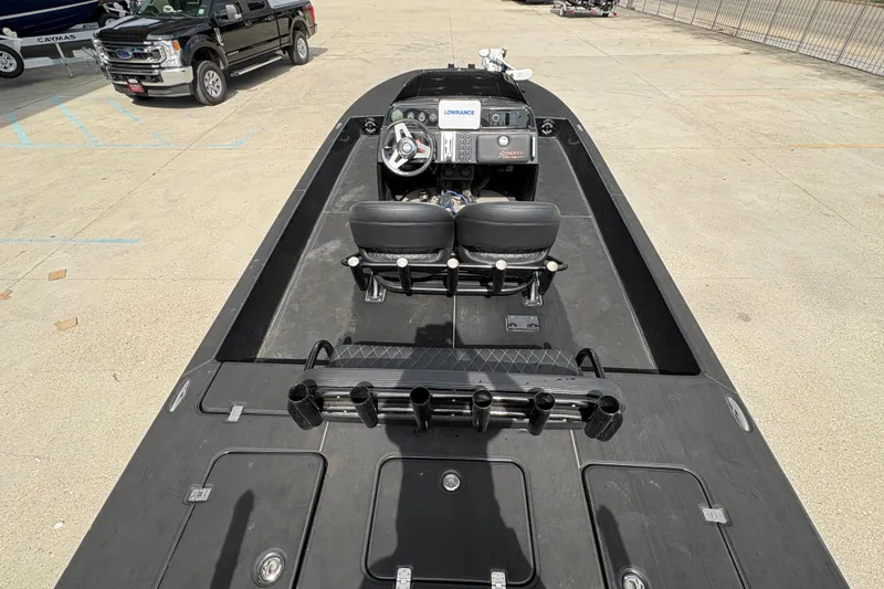 Slide: The Image of 2016 SCB 247 boat interior with dual seats and steering console. - 16