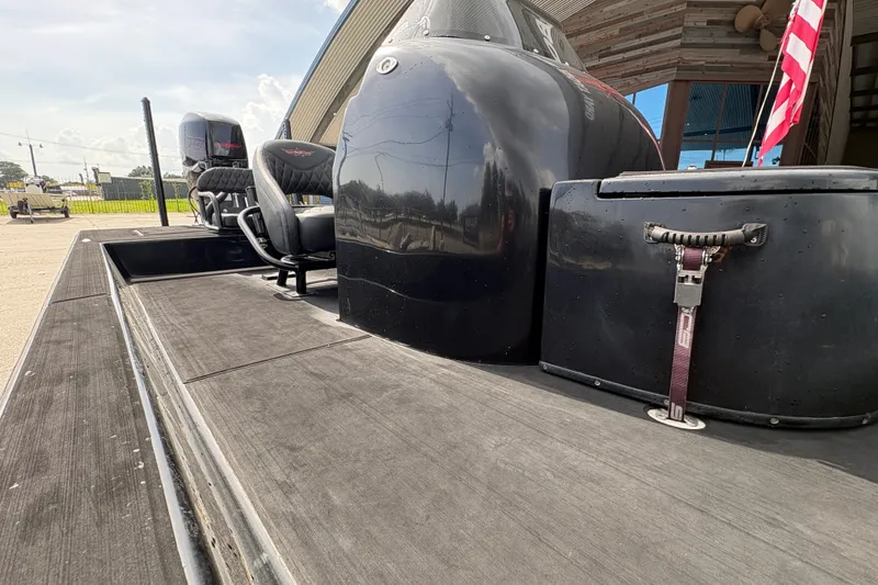 Slide: The Image of 2016 SCB 247 boat deck with seating and storage, featuring sleek black design. - 13