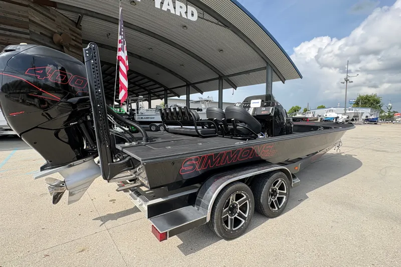 Slide: The Image of 2016 SCB 247 boat with Mercury 400 engine, parked under a canopy at a marina. - 4