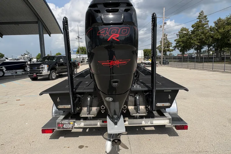 Slide: The Image of 2016 SCB 247 boat with powerful 400R engine on trailer, parked outdoors. - 5
