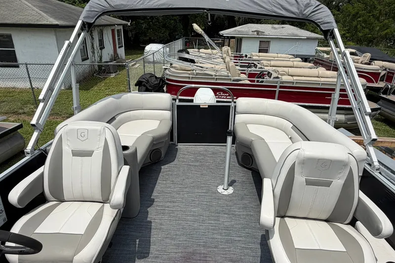 Slide: The Image of 2022 Sweetwater 2286 SBX pontoon boat with spacious seating and canopy. - 11