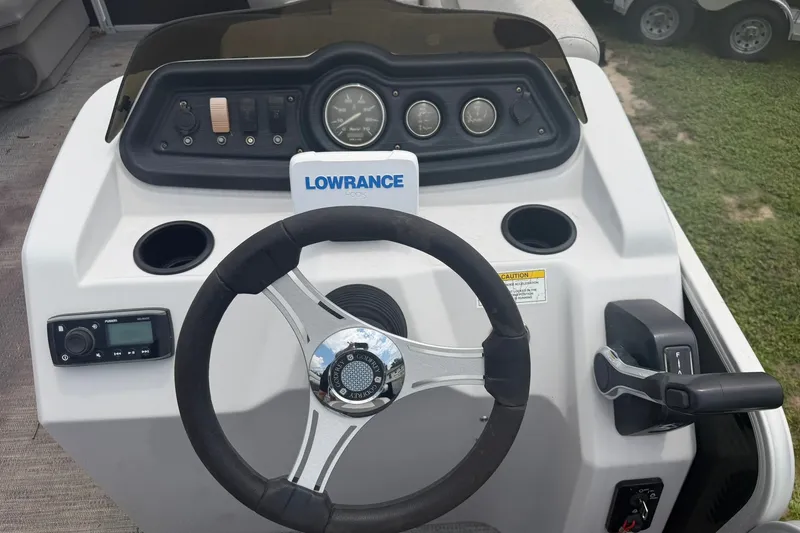 Slide: The Image of Steering console of 2022 Sweetwater 2286 SBX boat with Lowrance electronics. - 3