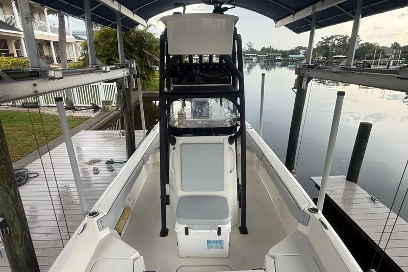 Slide: The Image of 2021 Skeeter SX2550 Fish boat docked under a canopy, ready for fishing. - 34