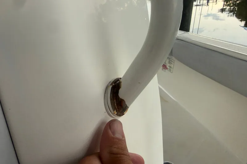 Slide: The Image of Close-up of a 2021 Skeeter SX2550 Fish boat handle with visible rust. - 35