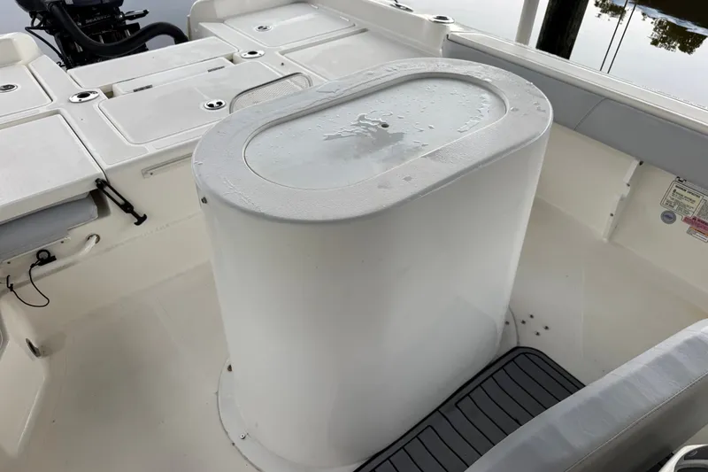 Slide: The Image of 2021 Skeeter SX2550 Fish boat interior with storage compartments and seating. - 19