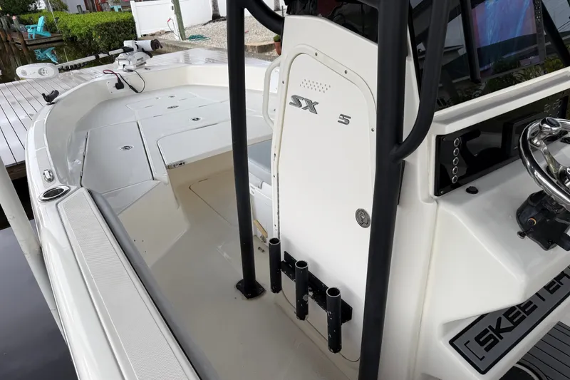 Slide: The Image of 2021 Skeeter SX2550 Fish boat interior with steering wheel and rod holders. - 27