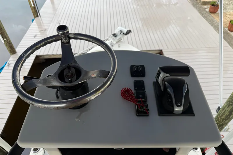 Slide: The Image of 2021 Skeeter SX2550 Fish boat helm with steering wheel and controls. - 40