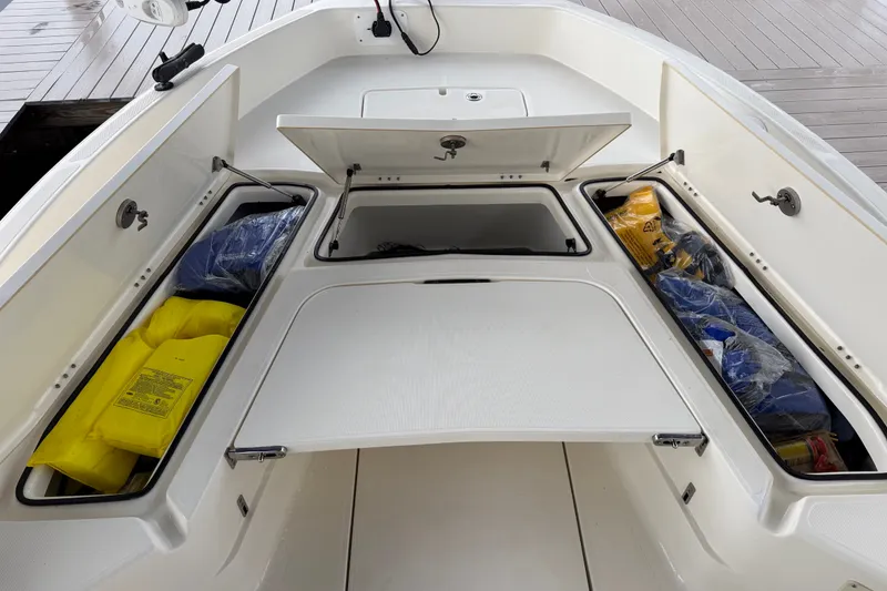 Slide: The Image of 2021 Skeeter SX2550 Fish boat storage compartments with safety gear and equipment. - 37