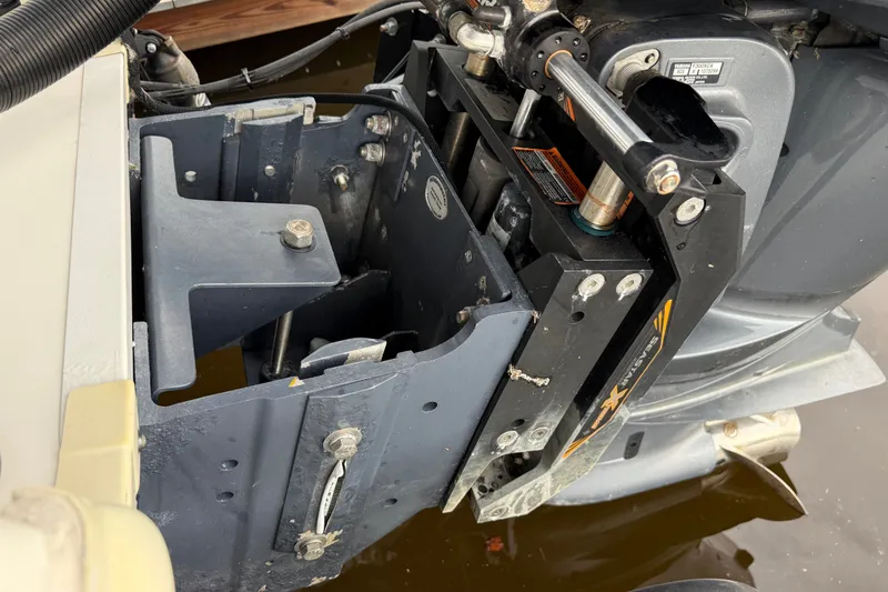 Slide: The Image of 2021 Skeeter SX2550 Fish boat motor mount detail with hydraulic components. - 10