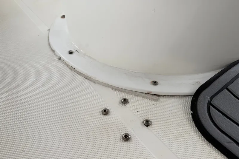 Slide: The Image of 2021 Skeeter SX2550 Fish boat deck with screws and textured surface. - 21