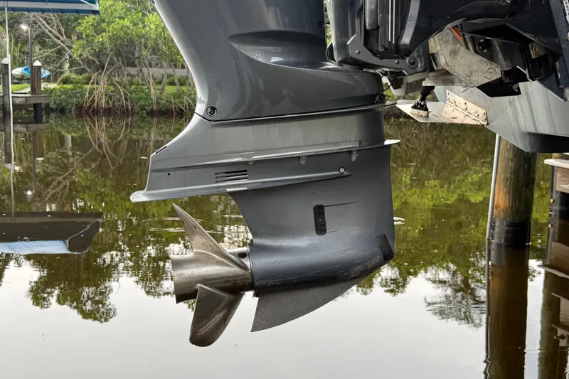 Slide: The Image of 2021 Skeeter SX2550 Fish boat motor and propeller on calm water. - 8