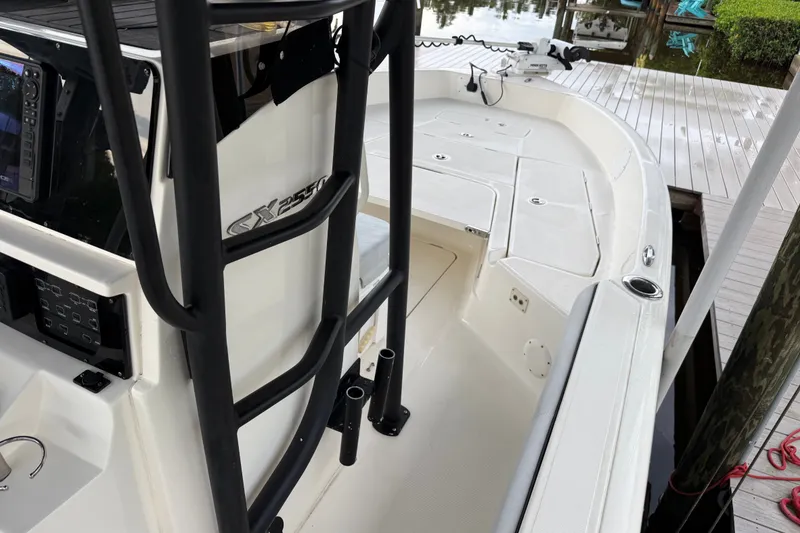 Slide: The Image of 2021 Skeeter SX2550 Fish boat docked, featuring spacious deck and modern controls. - 32