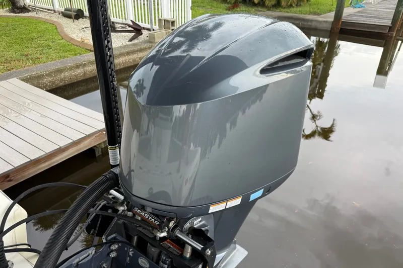 Slide: The Image of 2021 Skeeter SX2550 Fish boat engine by dockside water. - 11