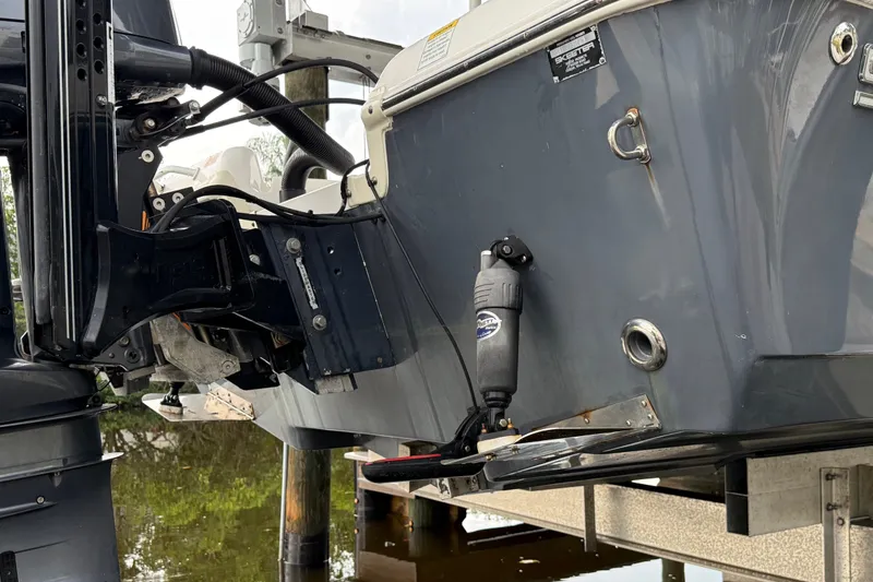 Slide: The Image of 2021 Skeeter SX2550 Fish boat stern with motor and hydraulic components. - 9