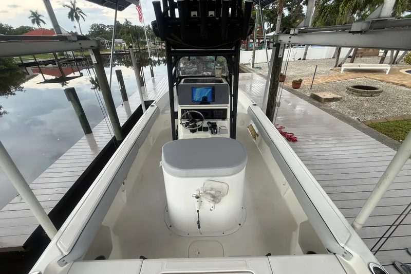 Slide: The Image of 2021 Skeeter SX2550 Fish boat docked, featuring a central console and modern navigation equipment. - 17