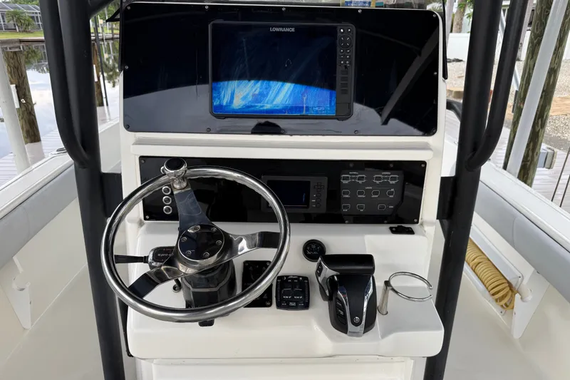 Slide: The Image of 2021 Skeeter SX2550 Fish boat console with steering wheel and navigation display. - 23