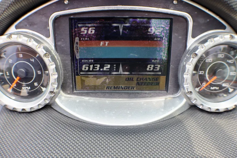 Slide: The Image of Dashboard of 2010 MasterCraft X-35 SS showing RPM, MPH, and digital display. - 16