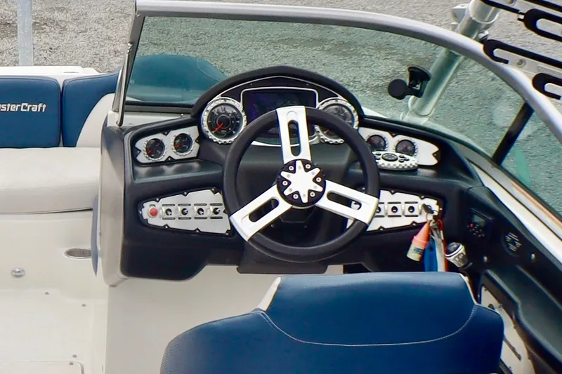 Slide: The Image of Steering console of 2010 MasterCraft X-35 SS boat with gauges and controls. - 15