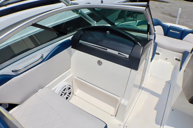 Slide: The Image of 2010 MasterCraft X-35 SS boat interior with sleek seating and modern dashboard design. - 17