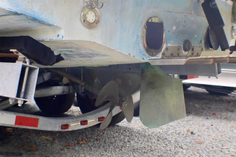 Slide: The Image of 2010 MasterCraft X-35 SS boat propeller and rudder on trailer, close-up view. - 8