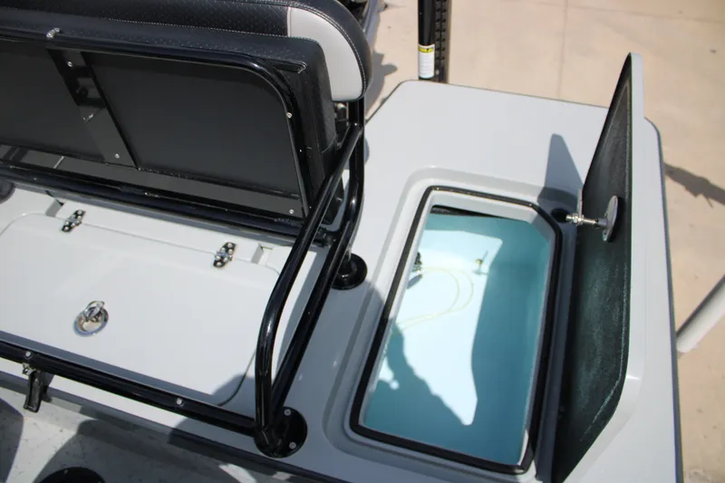 Slide: The Image of Open storage compartment on 2025 Mamba 24VX boat, featuring sleek design and functionality. - 15