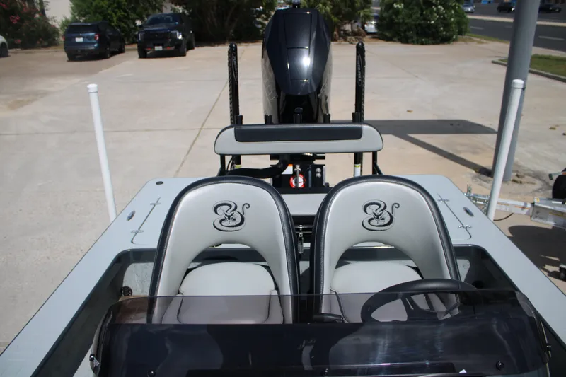 Slide: The Image of 2025 Mamba 24VX boat interior with dual seats and steering wheel. - 4