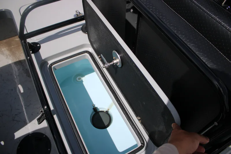 Slide: The Image of Livewell compartment in 2025 Mamba 24VX boat, showcasing interior design and functionality. - 14