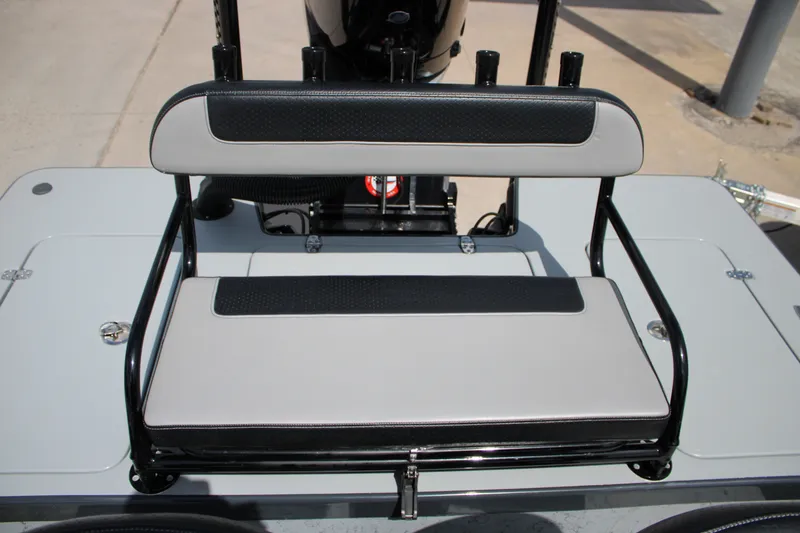 Slide: The Image of Mamba 24VX 2025 boat seat with black and gray upholstery, featuring sturdy metal frame. - 13