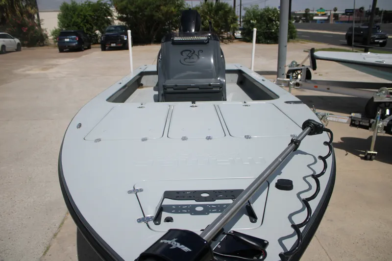 Slide: The Image of 2025 Mamba 24VX boat with sleek design, parked on a trailer in a sunny outdoor setting. - 7