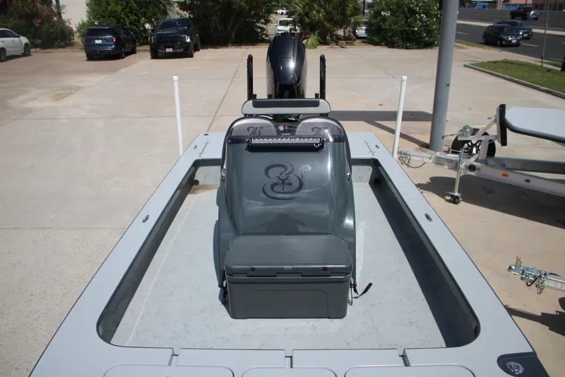 Slide: The Image of 2025 Mamba 24VX boat with sleek design, parked outdoors on a sunny day. - 10