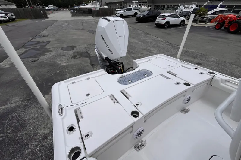 Slide: The Image of 2027 Tidewater 2500 Carolina Bay boat with Mercury engine, docked in a marina. - 6