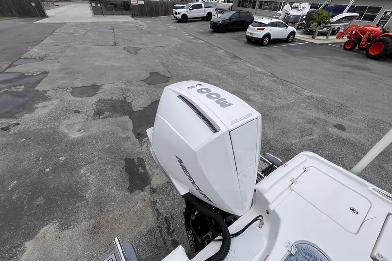 Slide: The Image of 2027 Tidewater 2500 Carolina Bay boat with Mercury outboard motor in a parking lot. - 5