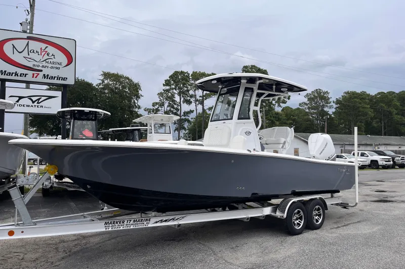 Slide: The Image of 2027 Tidewater 2500 Carolina Bay boat on trailer at Marker 17 Marine dealership. - 1