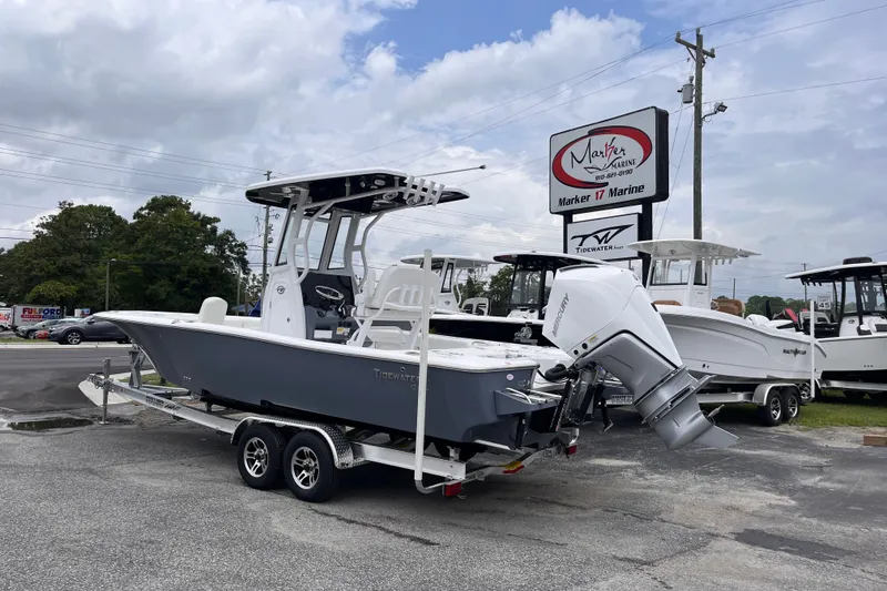 Slide: The Image of 2027 Tidewater 2500 Carolina Bay boat on trailer at Marker 17 Marine dealership. - 2