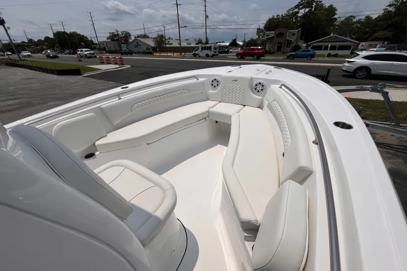Slide: The Image of 2027 Tidewater 232 CC Adventure boat with spacious white seating and modern design. - 9