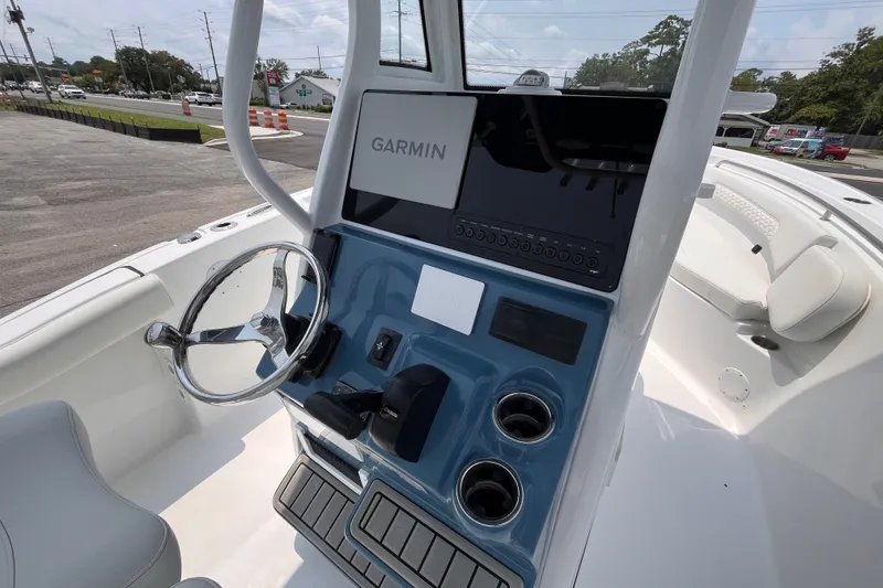 Slide: The Image of 2027 Tidewater 232 CC Adventure boat dashboard with Garmin navigation system. - 7