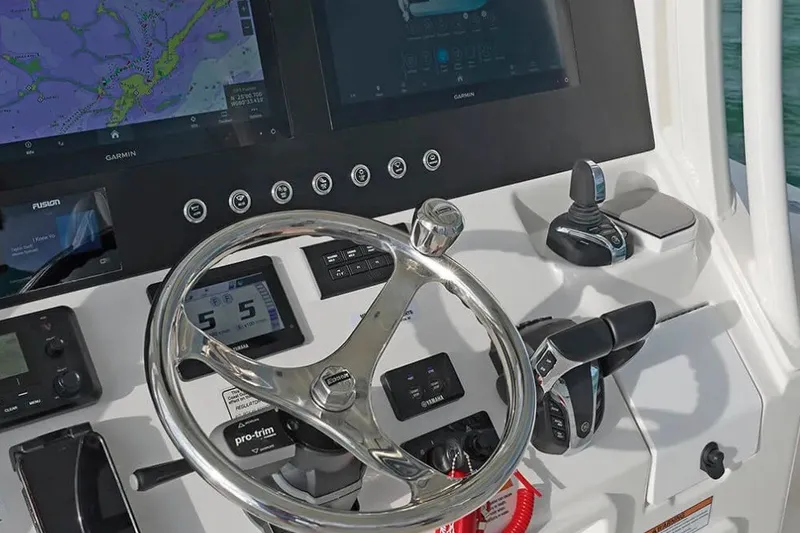 Slide: The Image of Helm of 2027 Regulator 30XO boat with advanced navigation and control systems. - 6