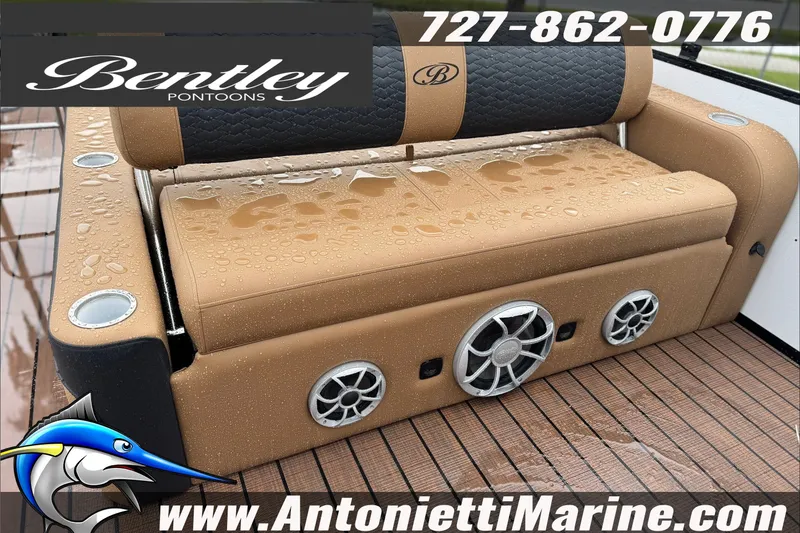 Slide: The Image of 2027 Bentley Pontoons Elite 253 Swingback with wet tan seating and marine speakers. - 5