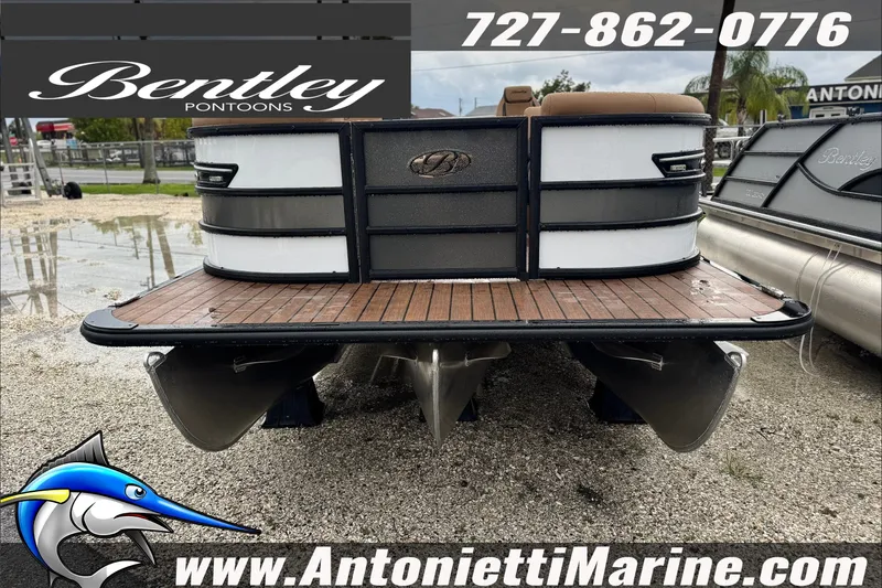 Slide: The Image of 2027 Bentley Pontoons Elite 253 Swingback displayed at Antonietti Marine dealership. - 2