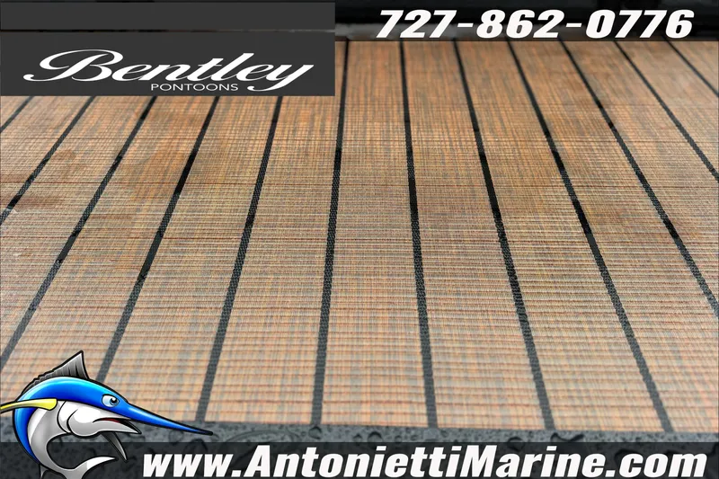 Slide: The Image of 2027 Bentley Pontoons Elite 253 Swingback flooring, featuring teak-style design. Contact Antonietti Marine. - 6