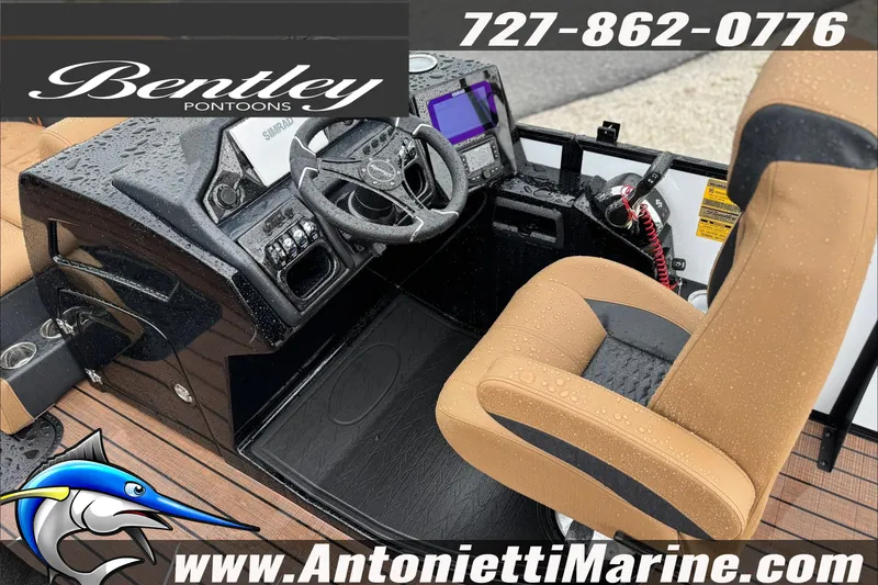 Slide: The Image of Interior of 2027 Bentley Pontoons Elite 253 Swingback with steering console and tan seating. - 4
