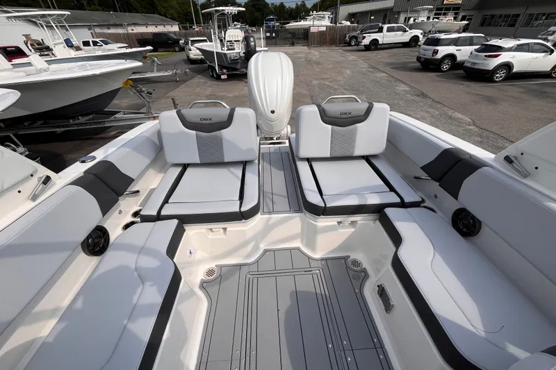 Slide: The Image of The image shows the cockpit of a 2025 Chaparral 250 OSX boat with luxurious seating. - 9