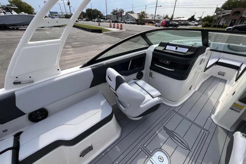 Slide: The Image of The image shows the cockpit of a 2025 Chaparral 250 OSX with modern seating and controls. - 10