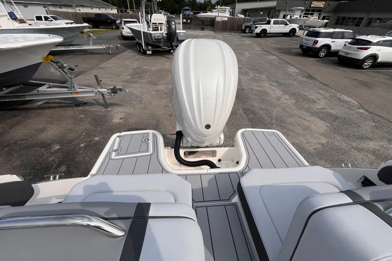Slide: The Image of The image shows the stern of a Chaparral 250 OSX boat with an outboard motor. - 8