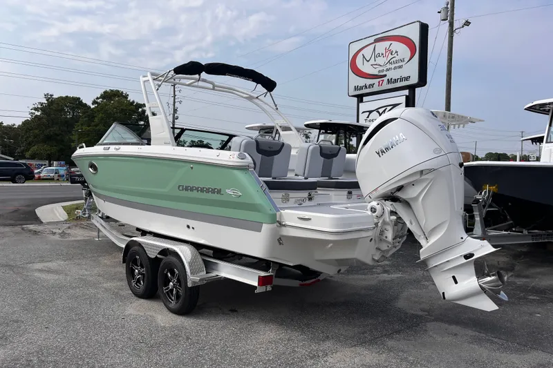 Slide: The Image of A 2025 Chaparral 250 OSX boat on a trailer, featuring a Yamaha outboard motor. - 3