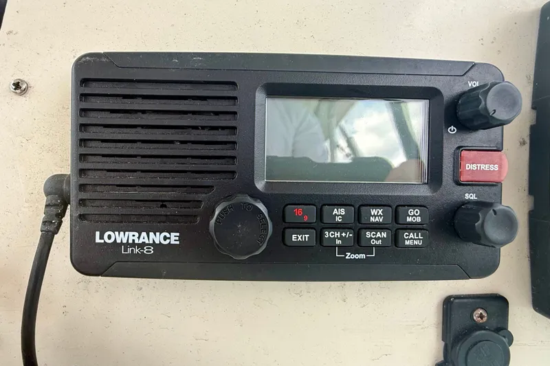 Slide: The Image of Lowrance Link-8 marine radio on 1993 Grady-White Dolphin 250 boat dashboard. - 14